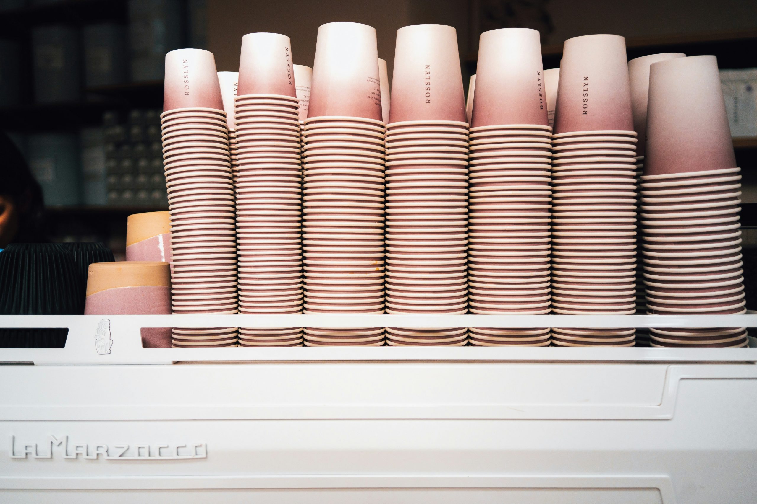 Pile of discarded makeup packaging highlighting environmental impact