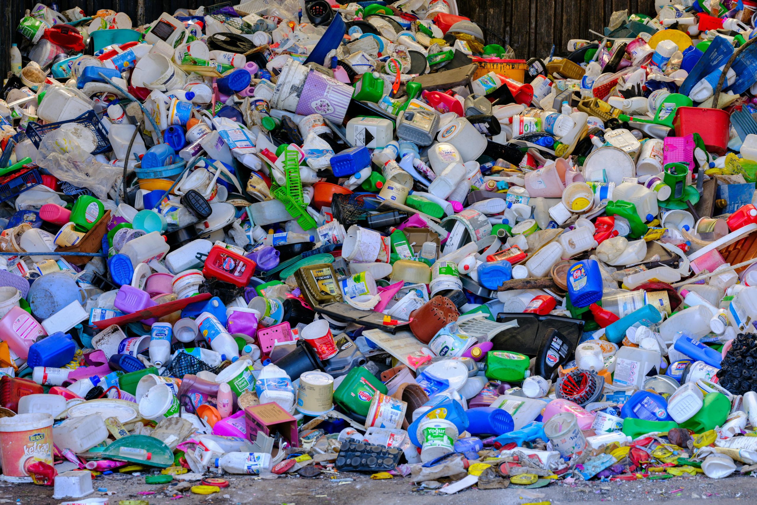 Piles of discarded plastic makeup containers contributing to pollution