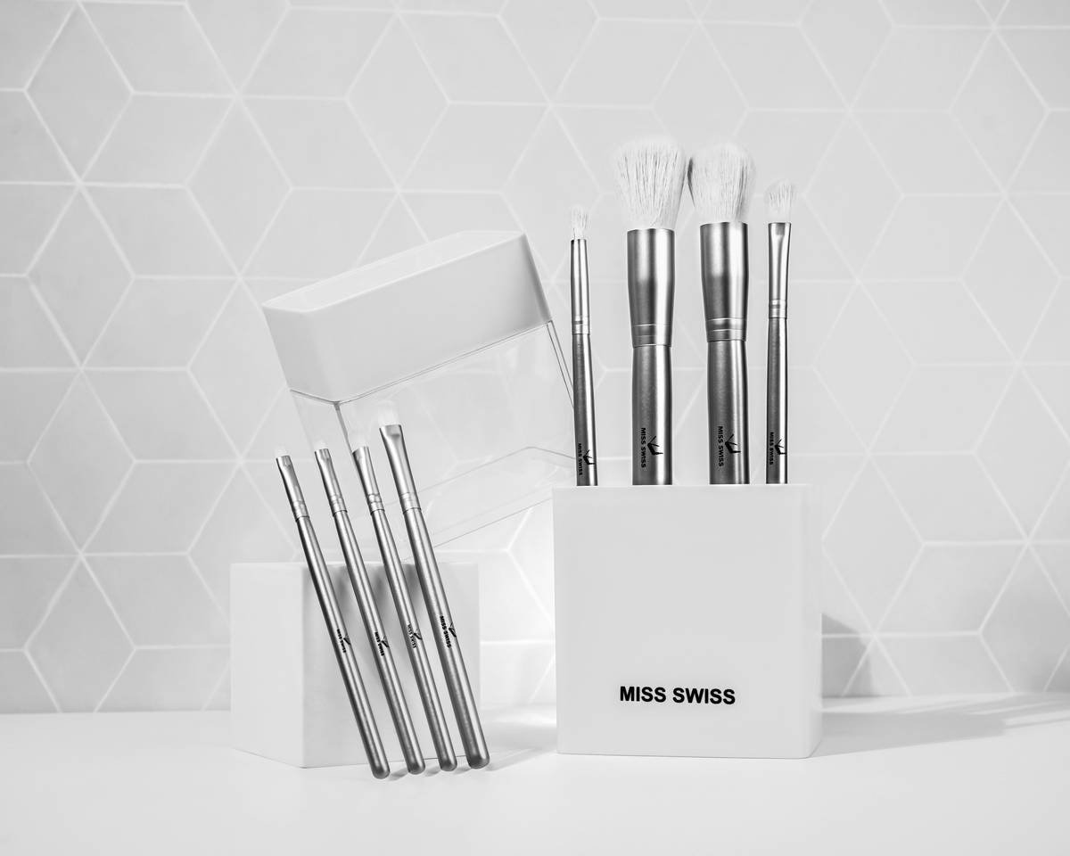 Close-up shot of hands washing a makeup brush