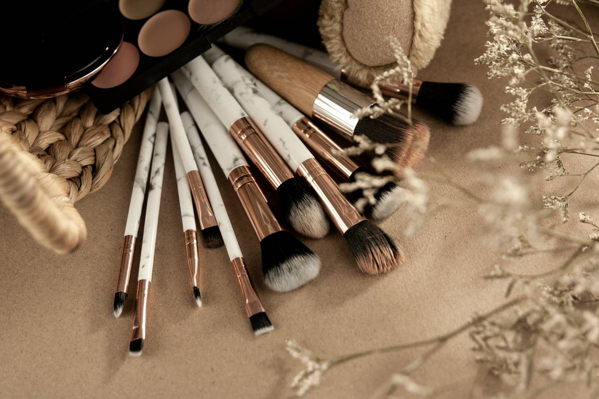 Influencer posing with eco makeup products and tools