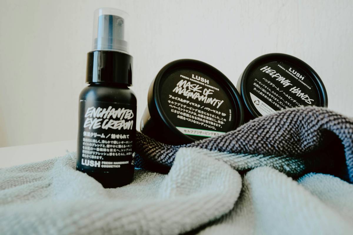 A closeup image of organic makeup products such as foundation, blush, and mascara.