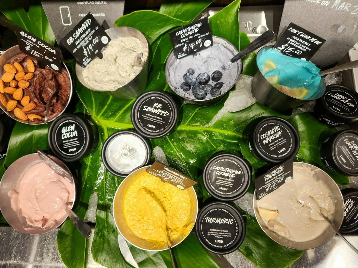 A close-up of earth-toned eyeshadows and lipsticks made from sustainable materials.